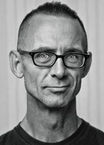 Black and white headshot of Chuck Palahniuk