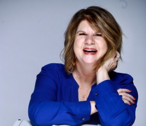 author photo of woman author laughing in blue shirt